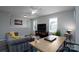 Bright living room with a ceiling fan, television, and gray sofa at 12719 Walking Stick Dr, Charlotte, NC 28278