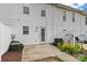 Townhome backyard showcasing patio, privacy fence, satellite dish, and landscaped area at 128 Locomotive Ln, Mooresville, NC 28115