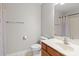 This cozy bathroom features a sink with storage, toilet, towel rack, and a large mirror above the sink at 128 Locomotive Ln, Mooresville, NC 28115