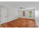 Light-filled living room with hardwood floors and a view of the windows at 128 Locomotive Ln, Mooresville, NC 28115