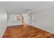 Spacious living area showcasing hardwood flooring, ceiling fan, and open layout at 128 Locomotive Ln, Mooresville, NC 28115