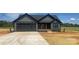 Charming single-story home with gray siding, black trim, and a concrete driveway at 1337 Hartsoe Rd, Lincolnton, NC 28092