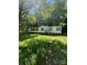 Quaint single-story home with brick foundation and front stairs surrounded by mature trees and greenery at 151 First S St # 122 & 123, Fort Mill, SC 29708