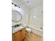 Bathroom featuring a round mirror and shower-tub combination at 1657 Diary Dr, Rock Hill, SC 29730