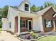 Charming brick and vinyl home with a welcoming front porch and manicured landscaping for enhanced curb appeal at 1657 Diary Dr, Rock Hill, SC 29730
