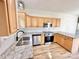 Open kitchen with stainless steel appliances, wood cabinets, and granite countertops at 1657 Diary Dr, Rock Hill, SC 29730