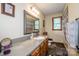 Bathroom with framed mirror, vanity with storage, bathtub and shower combo, and decorative accents at 2078 Valley View Ln, Lincolnton, NC 28092