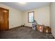 Bedroom features neutral walls, carpet, window with blinds, and wood-trimmed doors at 2078 Valley View Ln, Lincolnton, NC 28092