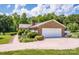 Side view of the property highlighting the 2-car garage and meticulous landscaping at 2078 Valley View Ln, Lincolnton, NC 28092