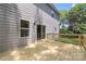 Large wooden deck adjacent to home with sliding glass doors and natural backyard view at 2313 Stallings Rd, Harrisburg, NC 28075