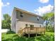 A charming two-story home with a wooden deck and a green backyard under a clear blue sky at 2313 Stallings Rd, Harrisburg, NC 28075