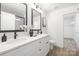 Modern bathroom with dual sinks, vanity, and sleek fixtures at 2313 Stallings Rd, Harrisburg, NC 28075