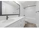 A bathroom featuring double sinks, white cabinetry, and modern fixtures at 2313 Stallings Rd, Harrisburg, NC 28075
