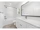 Bathroom with marble wall, double vanity with a big mirror and modern fixtures at 2313 Stallings Rd, Harrisburg, NC 28075