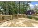 Spacious wooden deck with railings, perfect for outdoor entertaining with lush green yard at 2313 Stallings Rd, Harrisburg, NC 28075
