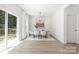 Elegant dining room with ample natural light and seamless access to outdoor deck at 2313 Stallings Rd, Harrisburg, NC 28075