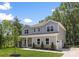 Attractive two-story home featuring an attached garage, stone accents and manicured lawn at 2313 Stallings Rd, Harrisburg, NC 28075