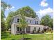 Charming two-story home with well-maintained lawn and landscaped front yard at 2313 Stallings Rd, Harrisburg, NC 28075