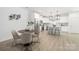 Modern kitchen boasts white cabinets, stainless steel appliances, and a stylish breakfast bar at 2313 Stallings Rd, Harrisburg, NC 28075