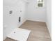 Clean, well lit laundry room featuring vinyl floor and basic utility sink at 2313 Stallings Rd, Harrisburg, NC 28075
