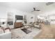 Bright, open-concept living room features wood floors, contemporary decor, and ample natural light at 2313 Stallings Rd, Harrisburg, NC 28075