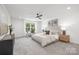 Large bedroom with ceiling fan, carpet floors, a window and neutral color scheme at 2313 Stallings Rd, Harrisburg, NC 28075