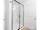 Modern shower stall with glass doors and white tiling at 2313 Stallings Rd, Harrisburg, NC 28075