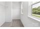 Carpeted walk-in closet with metal shelving at 2313 Stallings Rd, Harrisburg, NC 28075