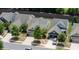 Aerial view of several homes with green lawns and tree lined street at 238 Cherrytree Dr, Fort Mill, SC 29715