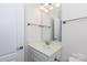 Small bathroom with white cabinets and sink and a large mirror at 238 Cherrytree Dr, Fort Mill, SC 29715