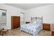 Bright bedroom features wood floor, floral bedding, and dark wood furniture at 238 Cherrytree Dr, Fort Mill, SC 29715