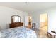 Bright bedroom with attached bathroom featuring wood floors and white trim at 238 Cherrytree Dr, Fort Mill, SC 29715