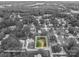 Aerial view highlighting property lot lines surrounded by lush, mature trees in a residential neighborhood at 2418 Live Oak Ct, Gastonia, NC 28056
