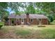 The backyard features a brick patio and chimney, perfect for outdoor entertaining at 2418 Live Oak Ct, Gastonia, NC 28056