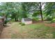 Spacious backyard featuring a shed, mature trees and an area for outdoor seating at 2418 Live Oak Ct, Gastonia, NC 28056
