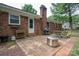 Brick home with outdoor patio and cooking area at 2418 Live Oak Ct, Gastonia, NC 28056