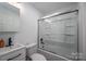 Well-lit bathroom with shower-tub combo, white fixtures, and contemporary sink at 2418 Live Oak Ct, Gastonia, NC 28056
