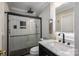 Bathroom features a glass shower, marble countertops, and black fixtures for a modern aesthetic at 2418 Live Oak Ct, Gastonia, NC 28056