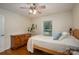Cozy bedroom features a neutral palette, hardwood floors, a ceiling fan, and natural light at 2418 Live Oak Ct, Gastonia, NC 28056