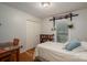 Bedroom with hardwood floors, a work desk, and a closet for storage at 2418 Live Oak Ct, Gastonia, NC 28056