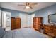 Well-lit bedroom features hardwood floors, a neutral palette, and plenty of storage at 2418 Live Oak Ct, Gastonia, NC 28056