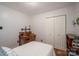 Bright bedroom featuring hardwood floors, a work desk, and a closet with storage space at 2418 Live Oak Ct, Gastonia, NC 28056