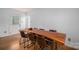 Bright dining room has wood floors, white walls, and a rustic wooden table with room to entertain at 2418 Live Oak Ct, Gastonia, NC 28056