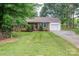 Charming brick ranch-style home with well-manicured lawn and mature trees in a quiet neighborhood at 2418 Live Oak Ct, Gastonia, NC 28056