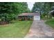 Traditional brick house with an attached garage and well-manicured front yard at 2418 Live Oak Ct, Gastonia, NC 28056