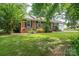 Traditional brick house with an attached garage and beautiful landscaping at 2418 Live Oak Ct, Gastonia, NC 28056