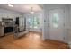 Spacious eat-in kitchen featuring updated appliances, ample cabinet space, and a convenient side door access at 2418 Live Oak Ct, Gastonia, NC 28056