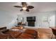 Cozy living room with a brick fireplace, hardwood floors, and a comfortable seating arrangement at 2418 Live Oak Ct, Gastonia, NC 28056