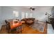 Spacious living and dining area with hardwood floors, wood table, and leather furniture, perfect for entertaining at 2418 Live Oak Ct, Gastonia, NC 28056