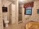 Bathroom featuring a shower stall, bathtub, and floral wallpaper at 2461 Ridgecrest Dr, Stanley, NC 28164